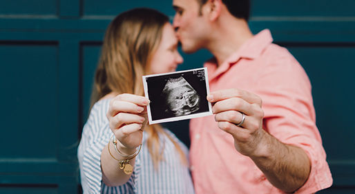 Newborn tile image couple holding photo